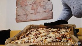 Stuffing a whole baking tray with loaded Nachos (MP4)