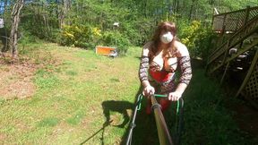 Exposed Giant Fake Tits Crossdresser in corset and Daisy Dukes running a push mower