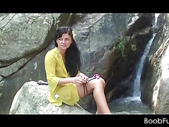 Amateur teen babe working her lusty twat by a waterfall