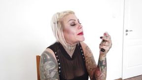 Tattooed blonde milf lipsticks her lips