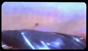 Sensational Redhead Domme Straps On for Latex Submissive Fun