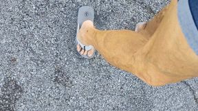 Tempest walking and flexing in grey flip flops