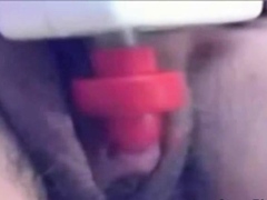a woman pumps her clit into a dick