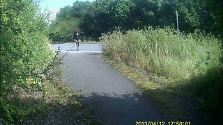 Crossdressed in black stockings in public path by road
