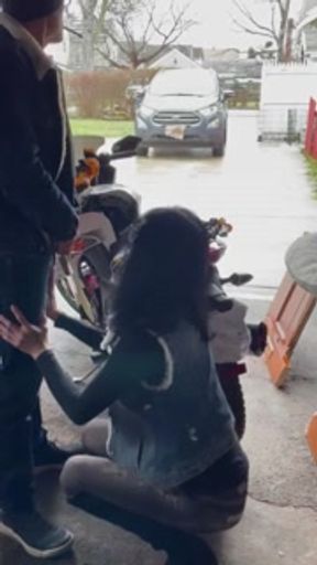 Chinese milf motorcycle needs repair roofers watching in background.