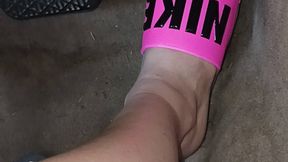 Driving the Benz in pink Nike slides