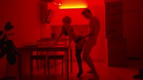 romantic couple sex under red neon