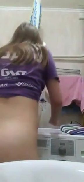 Slim blonde GF pleasures herself in a solo amature scene while lying