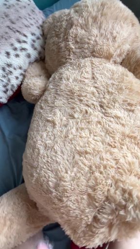 Amateur blonde lies down and jerks off while hugging a teddy bear