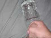 Solo masturbation cumshot into glass cup
