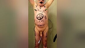 Satan slave takes a perverted piss enema session part 4