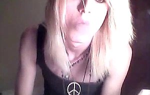Platinum blonde emo tgirl does a bit of softcore posing