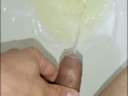 Desperate young man pissing, morning erection, close-up