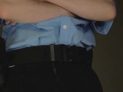 Officer has a bit of a wardrobe malfunction next to a group of women