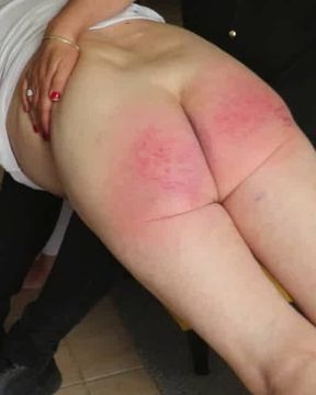 The Mistress gives me a bare-bottomed spanking on her knee
