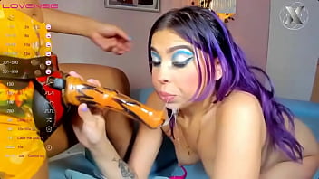 Sarina gives blowjobs to the strapon as if it were a cock