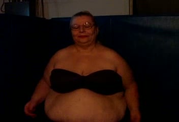 Fat and slutty blonde granny on webcam showing her huge tits