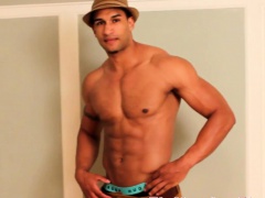 Ebony gay muscle hunk tugs his dong