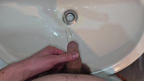 Hairy Cock Peeing Into the Sink in Bathroom with a Strong Stream