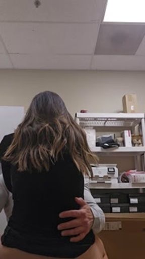 Beautiful girl in a dress sneaking a fuck in at work in back office