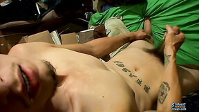 Inked twink Bentley pumps his dick with his eyes closed