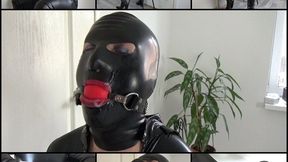 Cuffed Catwoman with cum on latex mask and in mouth