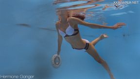 Intense and alluring underwater scene with a tiny, petite, and skinny sexy model named Hermione Ganger.