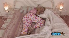 Tired blonde teen pulls down her pajama pants and fingers her smooth pussy
