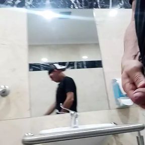 Hot guy plays with cock and gets naked at the mall restroom