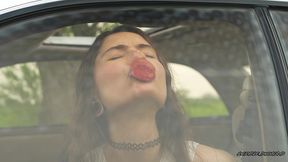 messy pink lipgloss marks on the car window