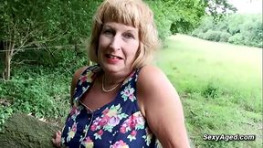 British blonde granny plays with her pussy outdoor