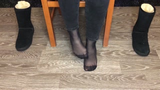Student girl show nylon socks, boots and foot after study