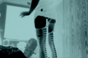 Femboy in fishnet stockings and stripper heels