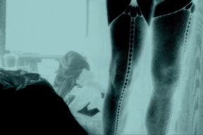 Femboy in fishnet stockings and stripper heels