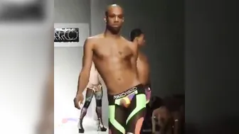 Black crossdressers vogue and strut on the runway in heels
