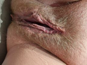 Wet slowly stroking in close-up