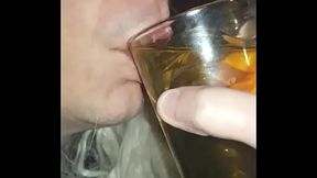 blindfolded bisexual crossdresser fed his own pee by his girlfriend