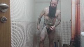 Solo male. Bearded & tattooed wolf in the douche