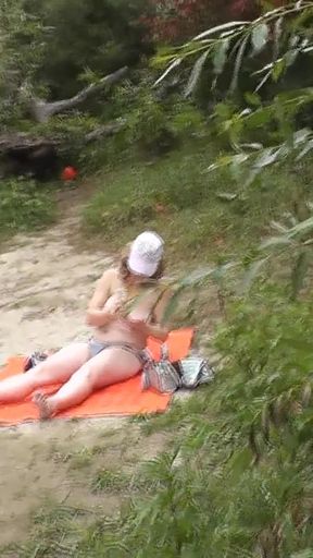 Memorable moment from &quot;Wild beach. Random passerby guy peeps on sunbathing topless beautiful Milf on the river bank&quot;
