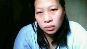 Ugly chunky Asian milf flashes her big tits on the webcam