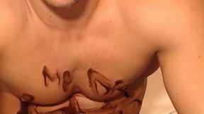 Muscular European Plays Nude with Melted Chocolate