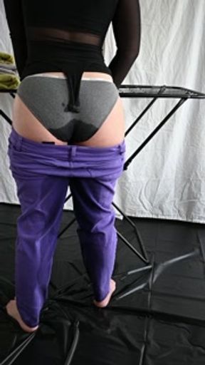 Wetting Purple Jeans While Doing Laundry
