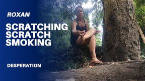 Scratching his feet in nature while smoking a cigarette (3)