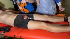 2 SADISTIC NURSES MILK PATIENNT'S COCK WHILE HE'S COMPLETELY BOUND IN LATEX MITTENS AND SPREAD BAR