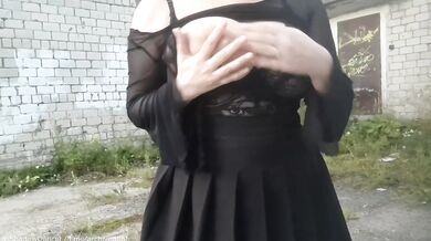 Brunette bombshell flashes big tits in public stockings