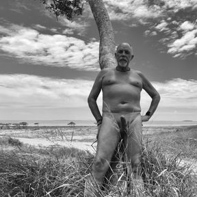 Playing outside at the beach nude and erect