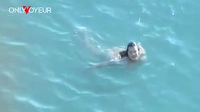 beach voyeur. naked hottie with big natural tits sucking cock