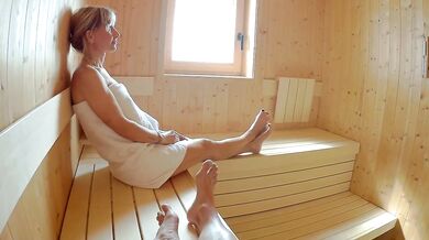 Blonde milf squirts all over him in the public sauna while he jerks off