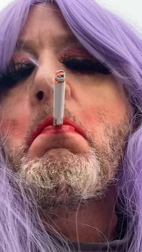 Crossdresser in Purple Wig Smoking POV