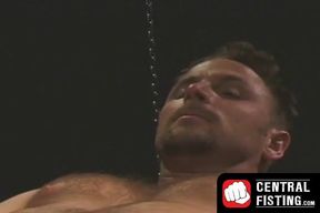 Kinky gay strokes his cock while enduring a hardcore fist fucking